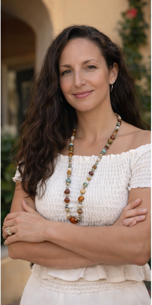 Danielle Norman, founder of Hidden Italy Travel, smiling in an Italian setting